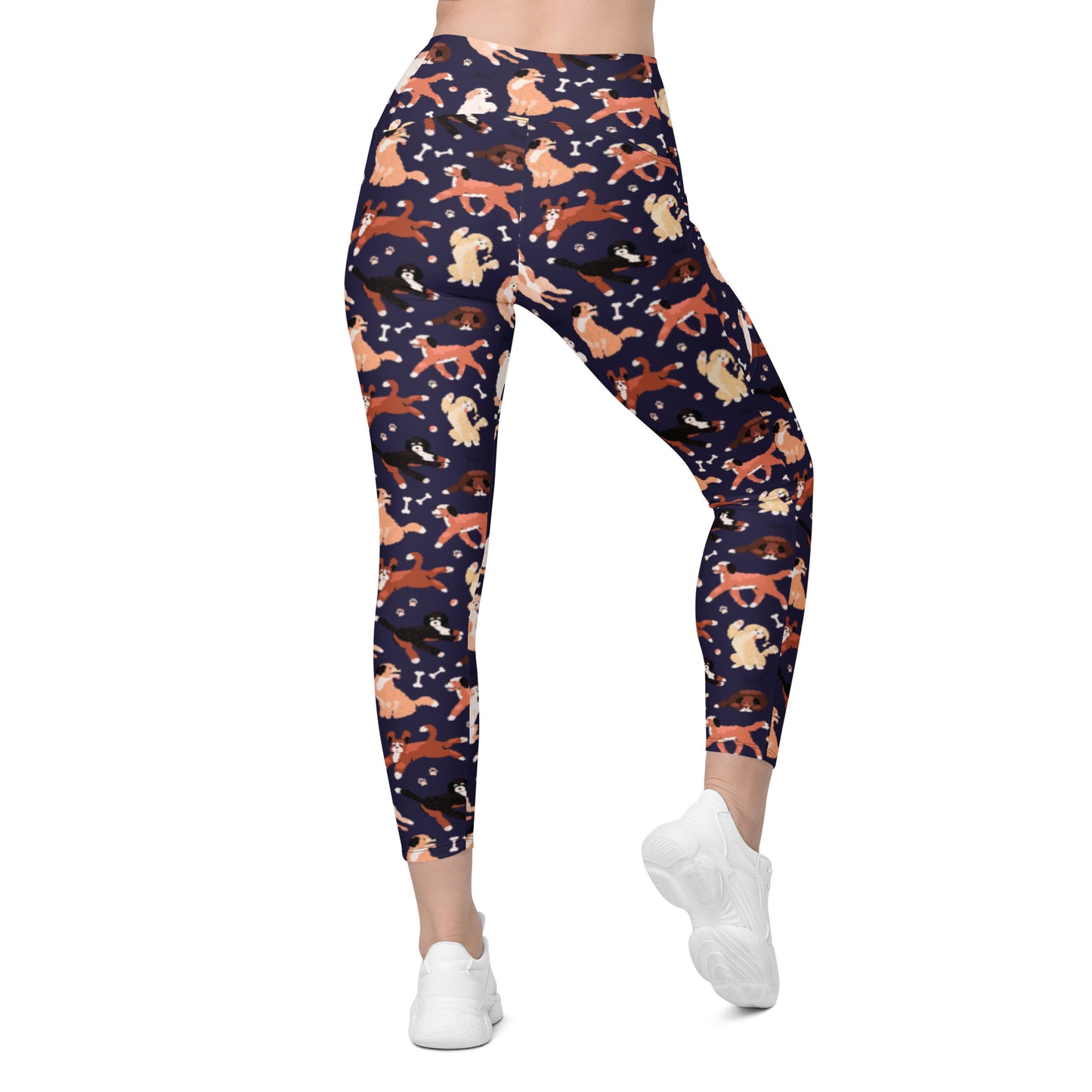 back view of Pixie and Sherbet’s Puppy Parade Crossover Leggings with a playful dog print, high-waisted crossover waistband, and side pockets.