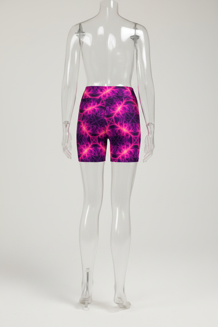 Rear view of a mannequin wearing high-waisted biker shorts with a vibrant magenta and purple fractal pattern on a white background.