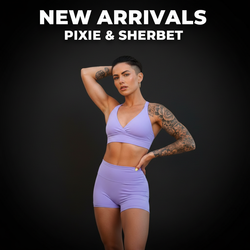 Woman posing against a beige background wearing white button-up shirt, floral print leggings, and tan cowboy boots while holding a cowboy hat, representing Pixie & Sherbet’s New Arrivals activewear collection.