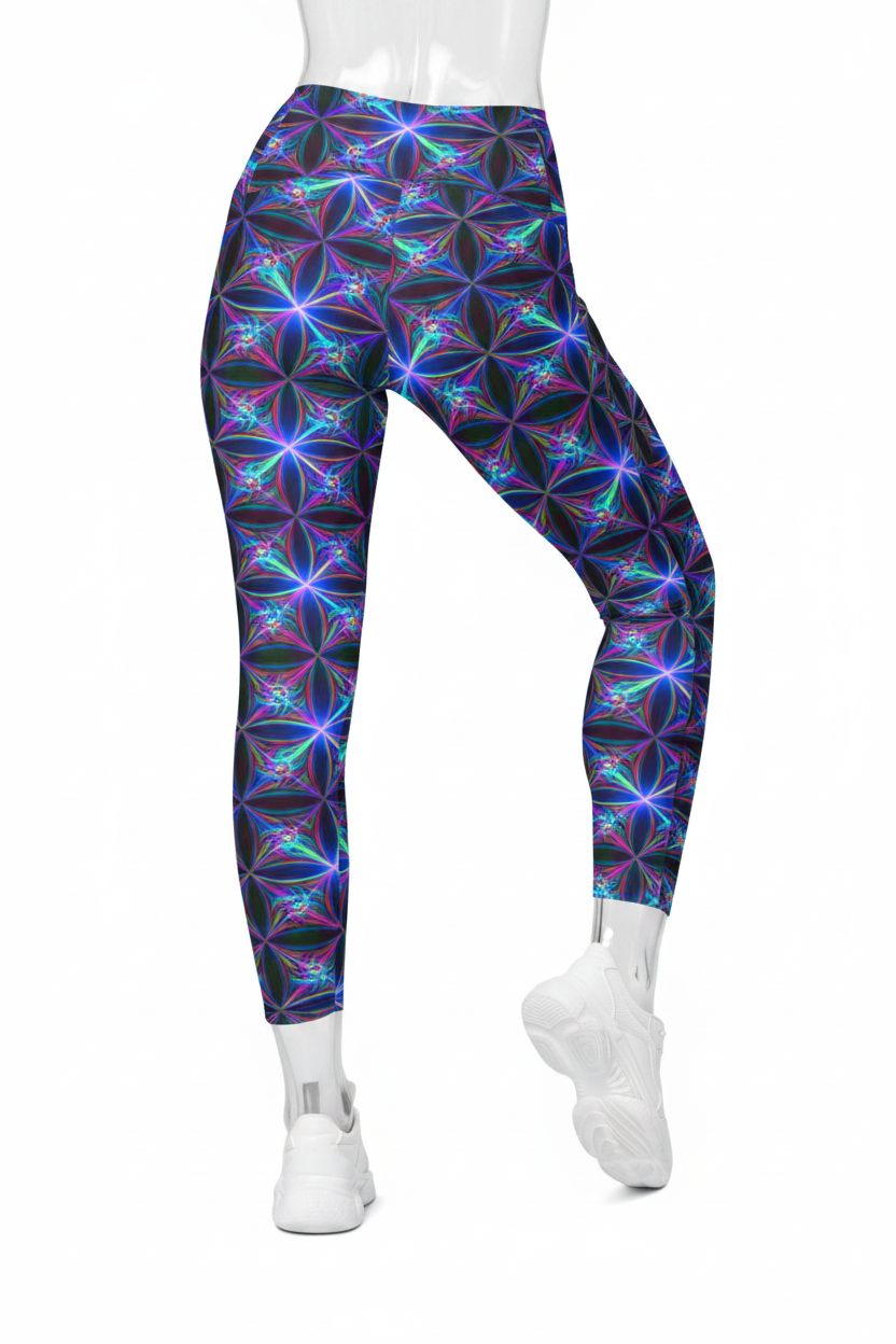 A mannequin wearing high-waisted leggings with a vibrant neon geometric flower pattern in purple, blue, and green on a black base, paired with white sneakers against a plain white background.