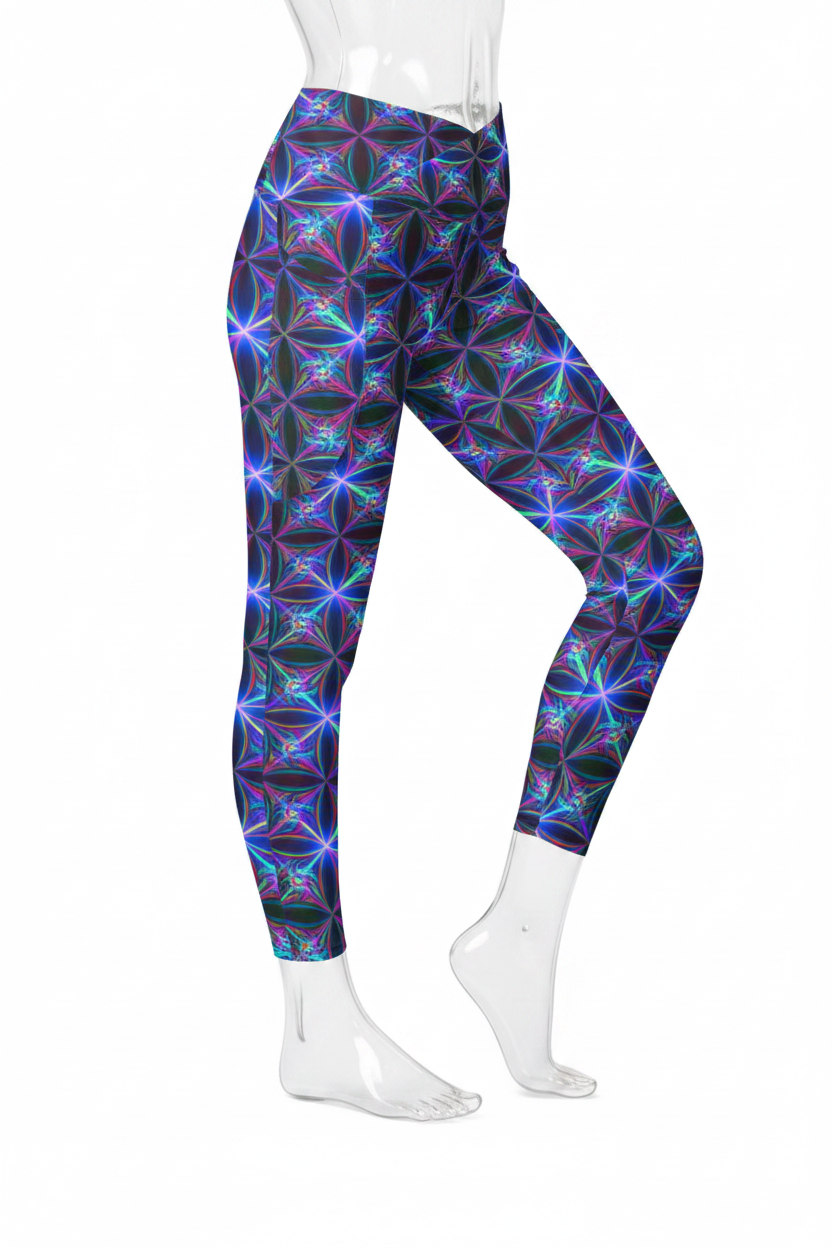 A mannequin wearing high-waisted leggings with a vibrant, multicolored geometric flower pattern in shades of purple, blue, and green, paired with white sneakers against a plain white background.