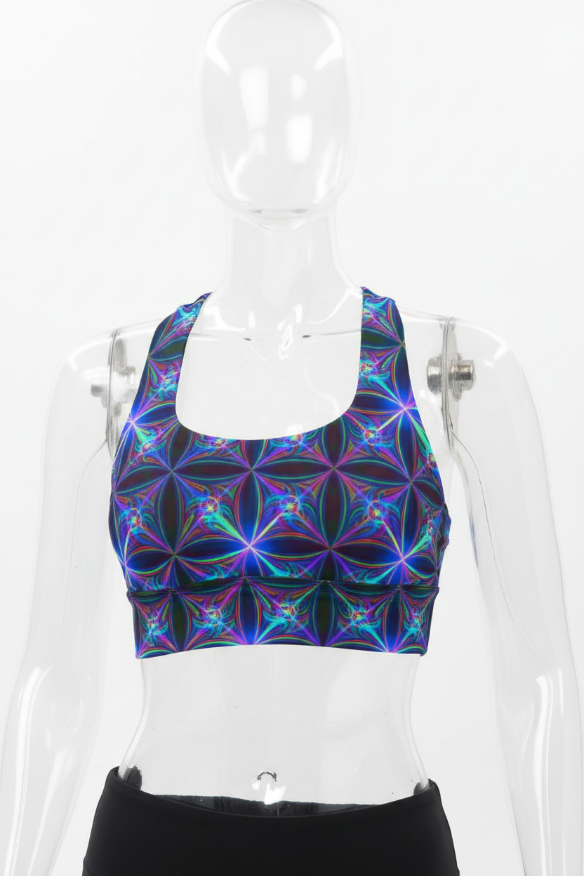 A manneqin wearing a sports bra with a vibrant, multicolored fractal floral pattern in shades of blue, purple, and green on a black base, set against a plain white background.