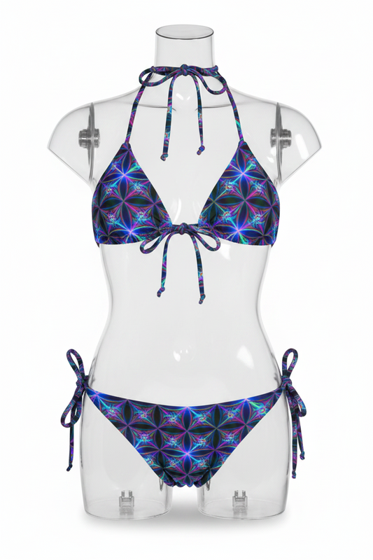 A two-piece string bikini set featuring a vibrant, multicolored kaleidoscopic geometric pattern on a black base, shown against a plain white background.