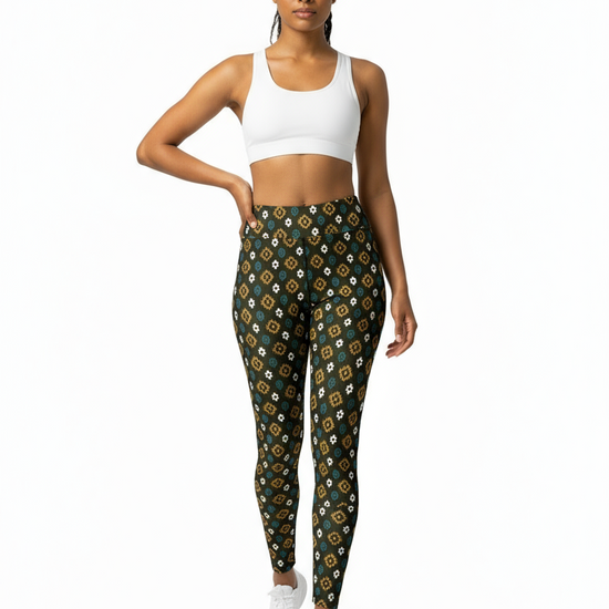 Woman wearing patterned leggings and a white sports bra on a white background