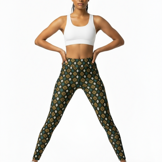 Woman wearing a white sports bra and patterned leggings on a white background