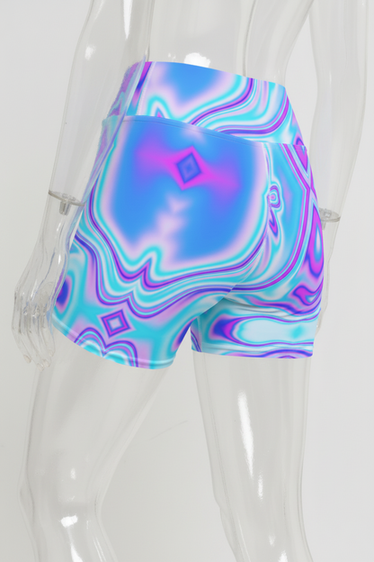 A close-up of a mannequin wearing high-waisted athletic shorts with a vibrant, abstract swirl pattern in shades of blue, purple, and white.