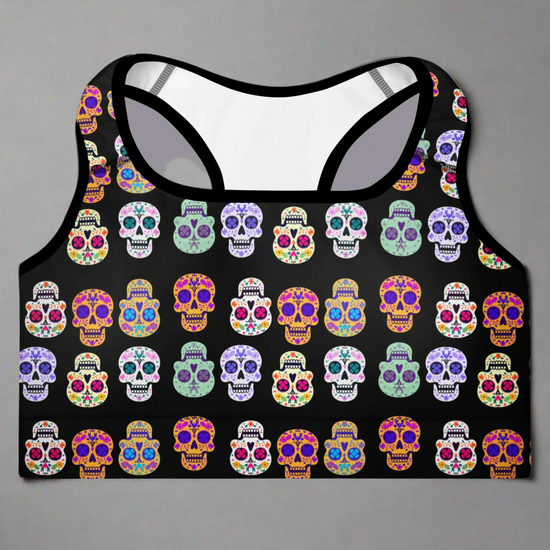 Black tank top with colorful skull pattern on a gray background
