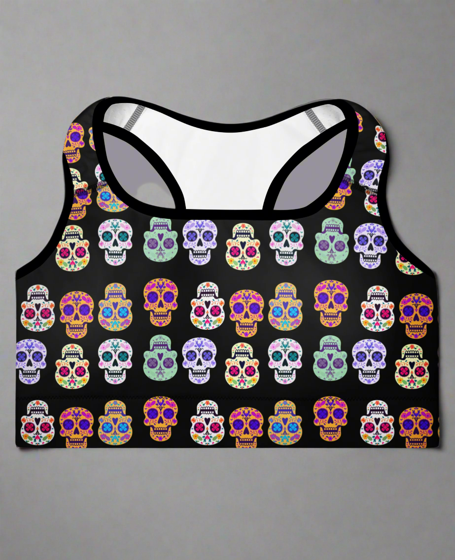 Black tank top with colorful skull pattern on a gray background