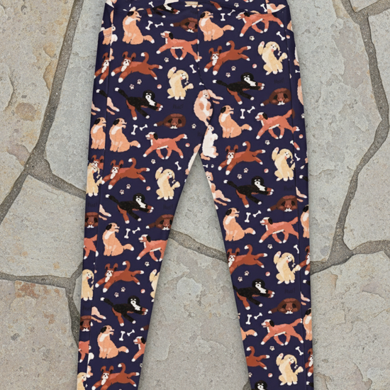 Navy leggings with a pattern of dogs on a white background