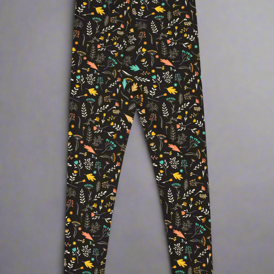 Leggings with colorful floral pattern on a black background