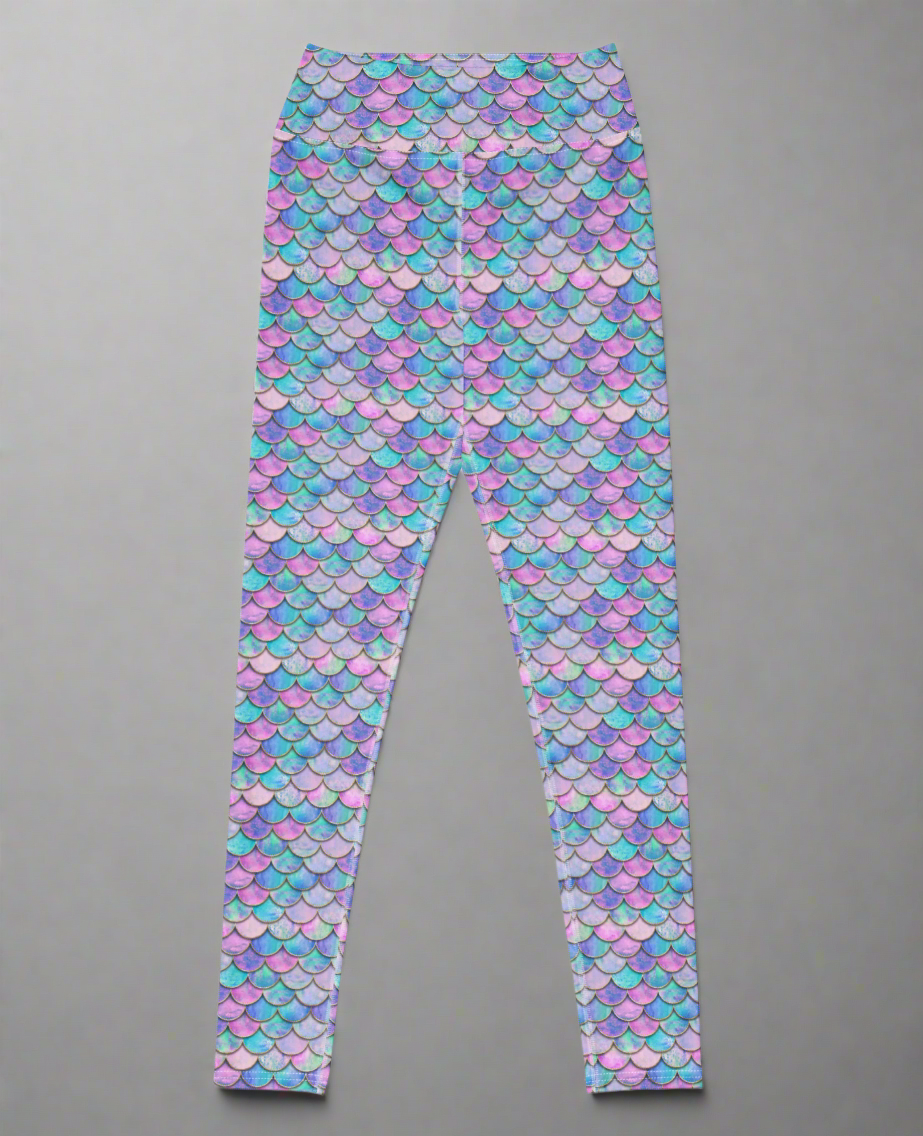 Colourful mermaid patterned leggings on a grey background