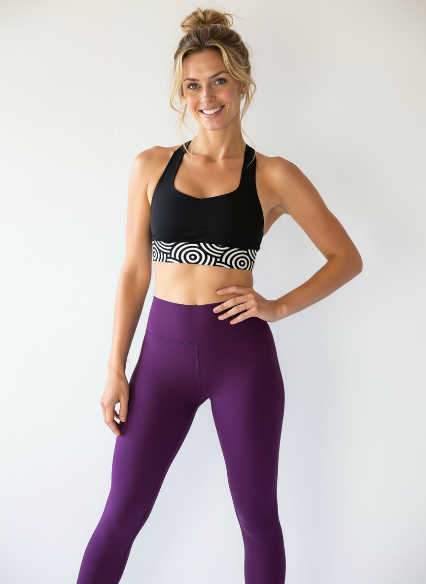 Lunar Loops Longline Sports Bra - Flat lay with purple leggings and fitness accessories