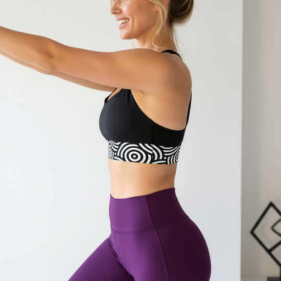 Lunar Loops Longline Sports Bra - Black racerback with white geometric circle pattern band, front view