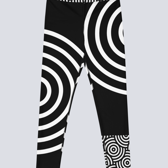 Front view of black high‑waisted Lunar Loops yoga leggings with bold white concentric circle pattern, featuring asymmetrical geometric design for a modern, eye‑catching look.