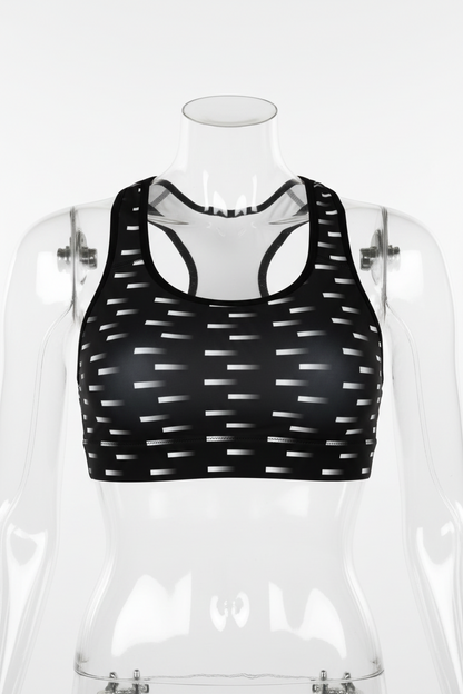 Black racerback sports bra with a repeating horizontal white stripe pattern, shown against a plain white background. 