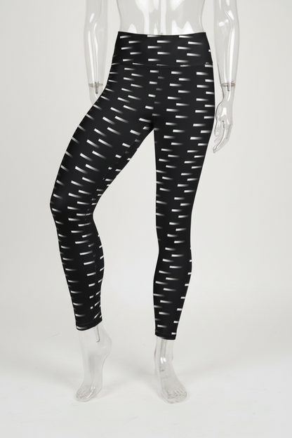 Black high-waisted leggings with a white geometric dash pattern, shown on a mannequin against a plain white background. 