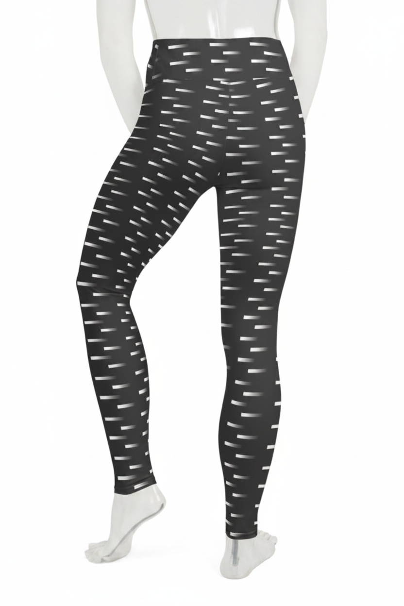 Black high-waisted leggings with a white dash pattern, shown on a mannequin from the back against a white background.