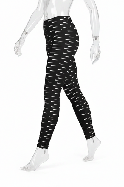 Black high-waisted leggings with a white dash pattern, shown on a mannequin from the waist down against a white background.