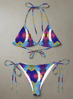 Colorful tie-dye bikini set on a gray background