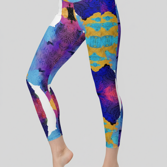 Colorful patterned leggings worn by a person on a gray background