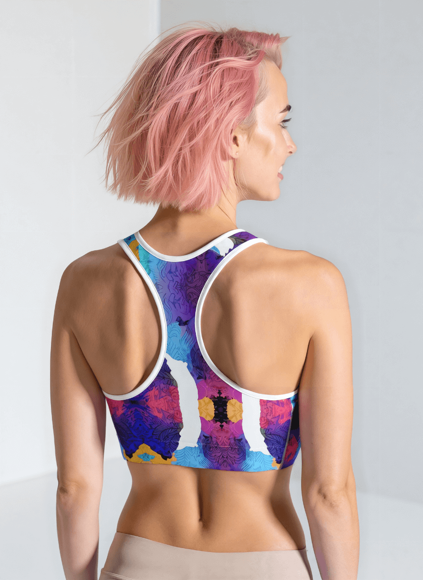 Person wearing a colorful sports bra with a white background