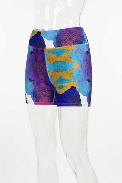 A mannequin wearing high-waisted athletic shorts with a bold abstract print in purple, blue, yellow, and white on a plain white background.