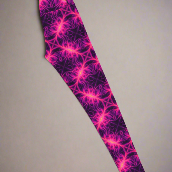 Right-side flat lay of Orchid Current Yoga Leggings featuring a vivid neon pink fractal-inspired pattern on a deep purple background, highlighting the bold and symmetrical design.