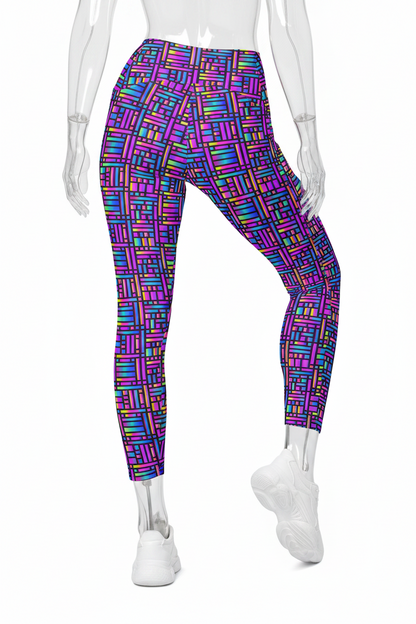 A mannequin wearing high-waisted leggings with a colorful geometric block pattern in purple, blue, pink, green, and orange, paired with white sneakers, shown against a plain white background.