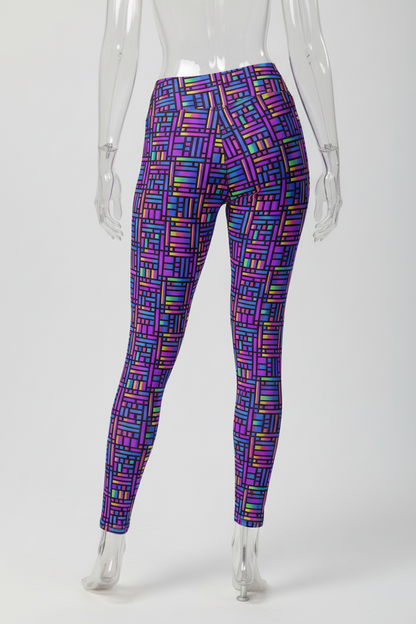 A mannequin shown from the back wearing high-waisted leggings with a dense multicolor geometric block pattern on a white studio background.