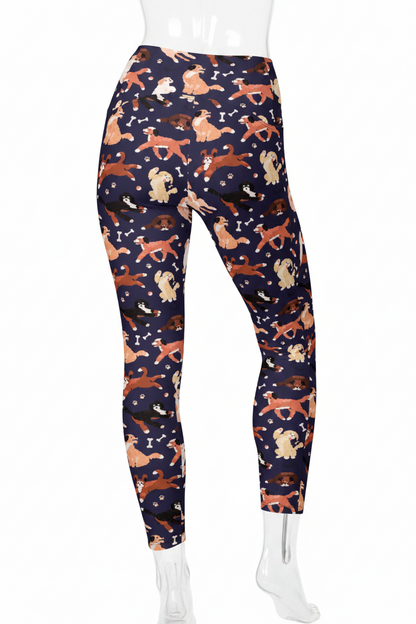 A pair of high-waisted leggings with an all-over dog print on a navy blue background, shown on a model against a plain white background. 