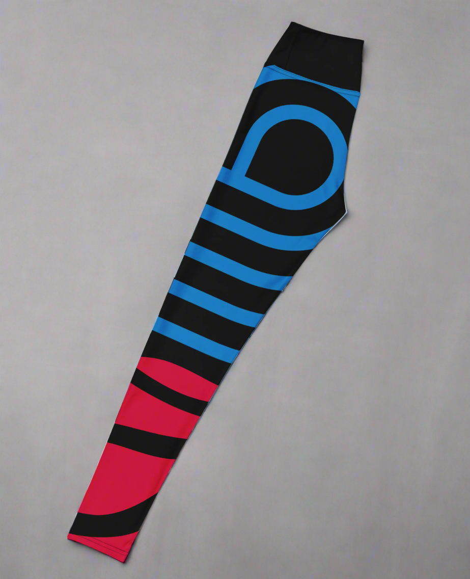 Left side flat lay view of yoga leggings with black, blue, and red stripes on a gray background