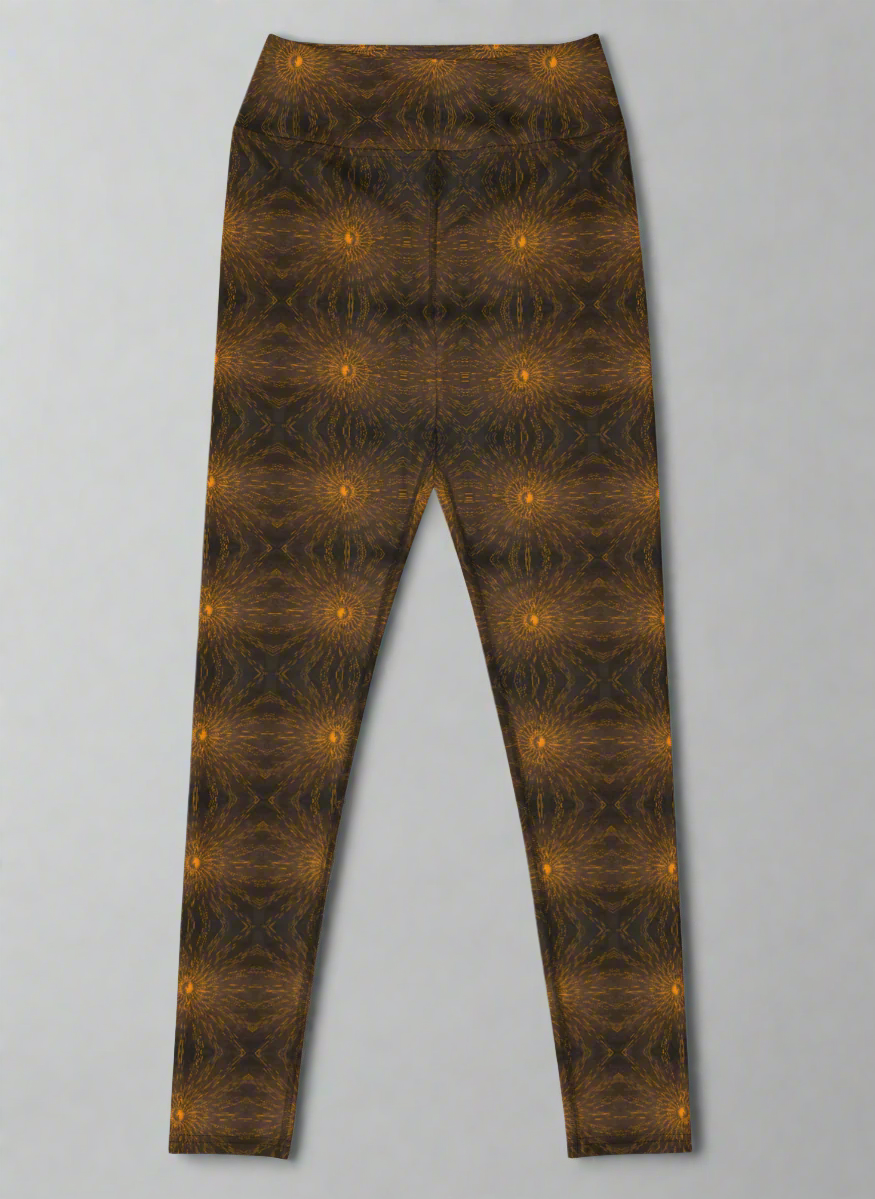  Front-flat product image of Rustic Amber leggings showing the full front panel and high-rise waistband, symmetrical mirrored brown and black kaleidoscope pattern with regularly spaced glowing orange circular motifs, full-length silhouette on a neutral background.