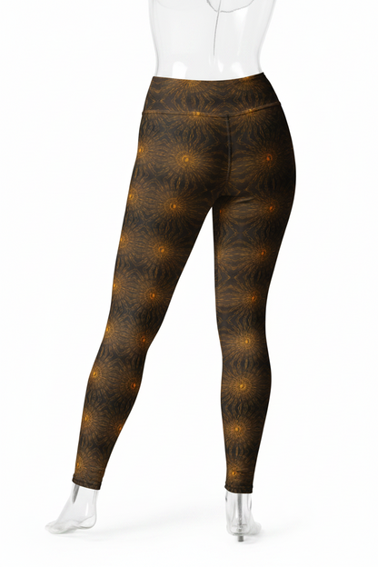 A mannequin modeling high-waisted leggings with a dark brown and black abstract pattern accented by glowing golden-yellow circular motifs, shown from the back against a plain white background.