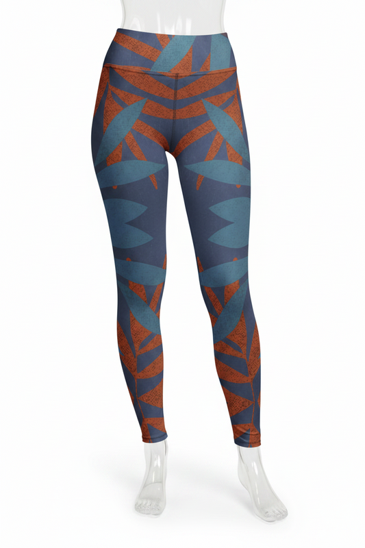 A mannequin wearing high-waisted leggings with a geometric pattern in slate blue, rust orange, and dark navy, shown from the waist down on a white background.