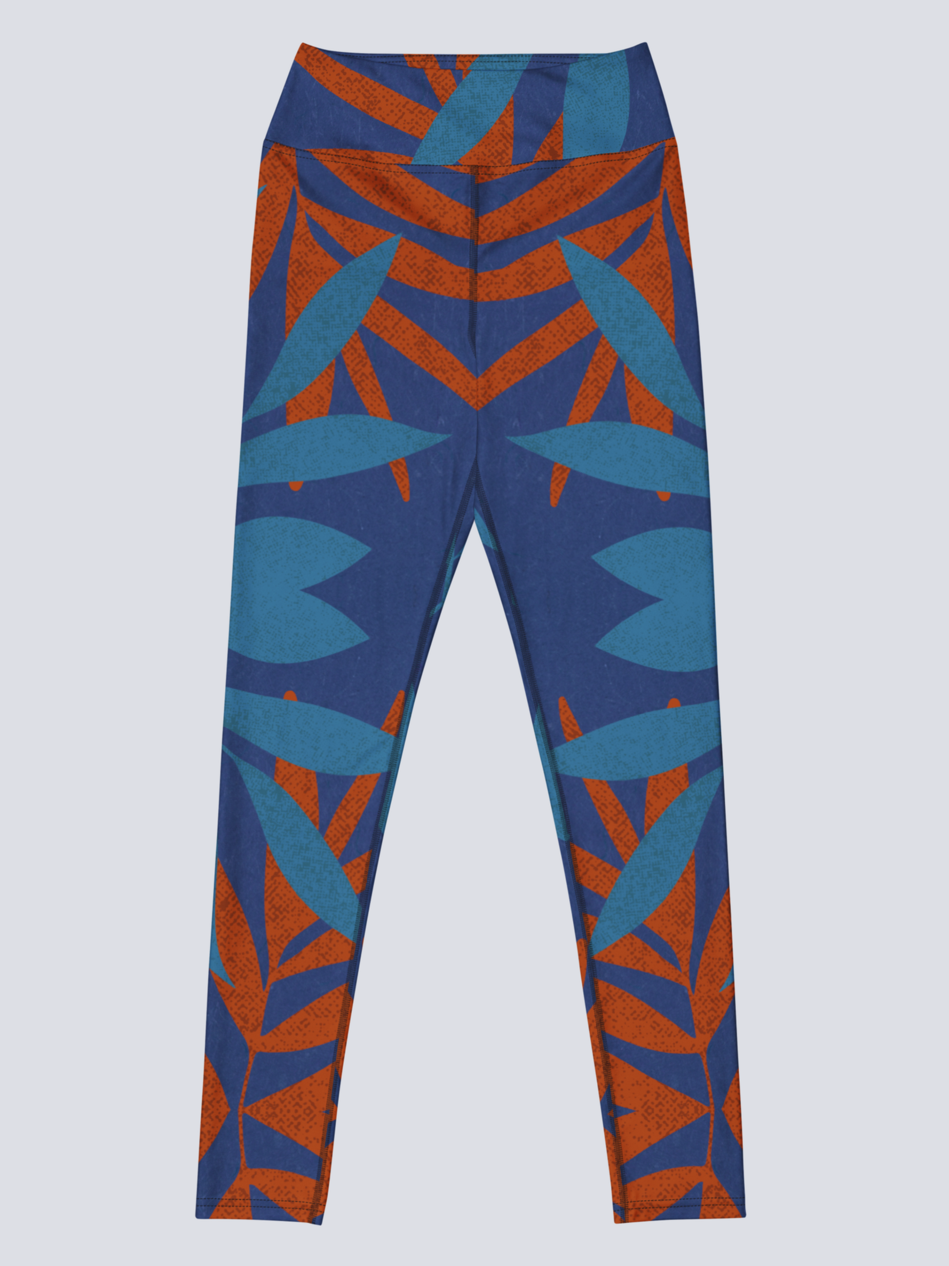 Blue and burnt orange patterned yoga leggings on a light grey background