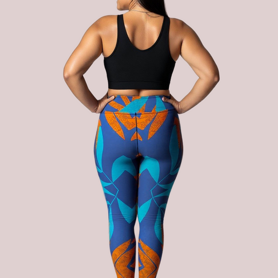 Back view of a barefoot model wearing Pixie & Sherbet’s Rustic Rhythm Yoga leggings with vibrant blue and orange geometric patterns, paired with a black sleeveless crop top, standing confidently against a white background.
This version keeps the tone consistent with your brand’s empowering aesthetic while spotlighting the leggings’ symmetry and colou story. If you’re building a full campaign set, I can help you weave a cohesive narrative across all alt texts to enhance SEO and visual storytelling. Just say 