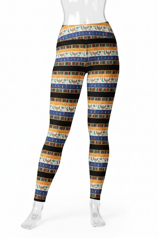 A mannequin modeling high-waisted leggings with horizontal stripes featuring ancient Egyptian motifs, including a scarab beetle, in blue, gold, black, and white.