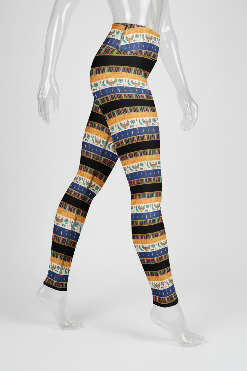 A mannequin modeling high-waisted leggings with a horizontal striped pattern in navy blue, mustard yellow, black, and white with small decorative motifs.