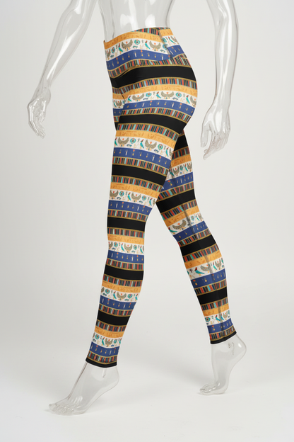 A mannequin modeling high-waisted leggings with a repeating horizontal striped pattern in navy blue, mustard yellow, black, and cream, shown against a plain white background.