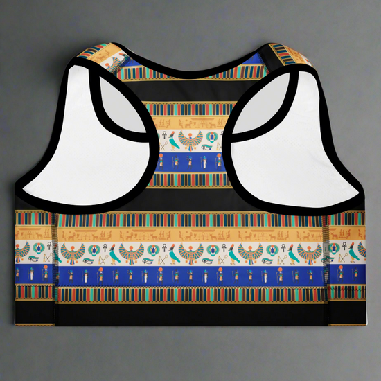 back view of Sapphire Essential Active Bra featuring blue, gold, black, and white Egyptian-inspired pattern with hieroglyphics, Eye of Horus, and scarab motifs; displayed against a plain background.