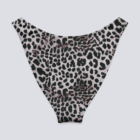 Flat-lay of Savannah Charge Cheeky Bikini Bottoms in high-cut monochrome leopard print – bold, sculpting swimwear with Pixie & Sherbet’s signature style.