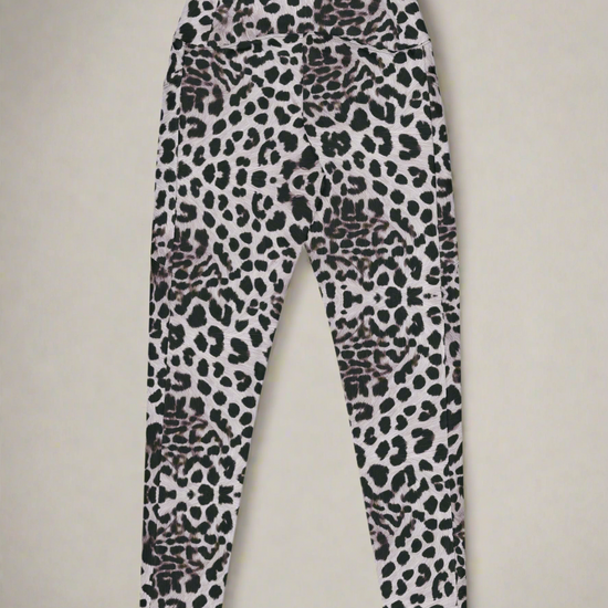 Back flat lay view of Savannah Charge Crossover Leggings with pockets and leopard print, on a white background