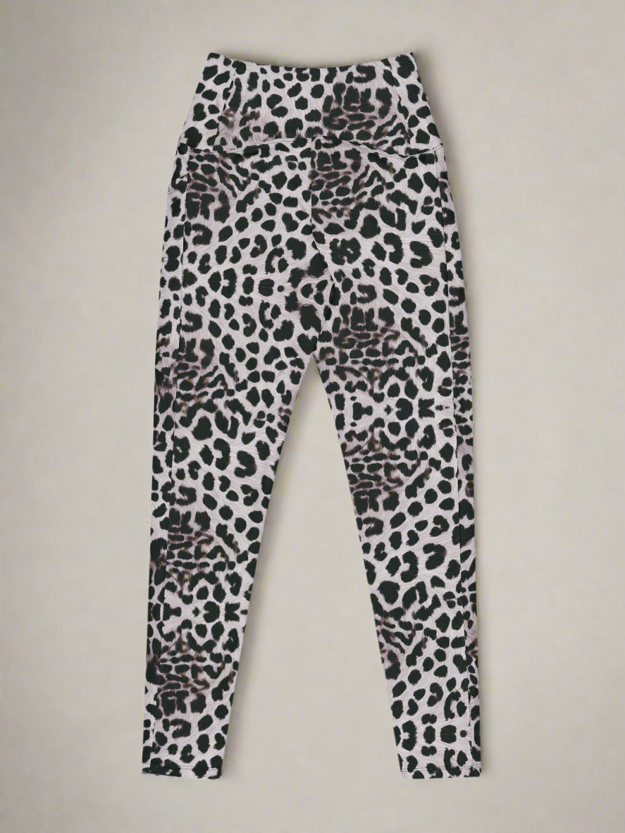 Back flat lay view of Savannah Charge Crossover Leggings with pockets and leopard print, on a white background