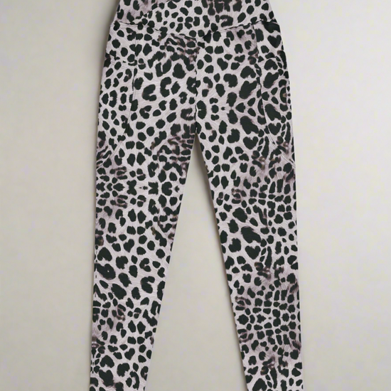 Front flat lay view of Savannah Charge Crossover Leggings with pockets and leopard print, on a white background