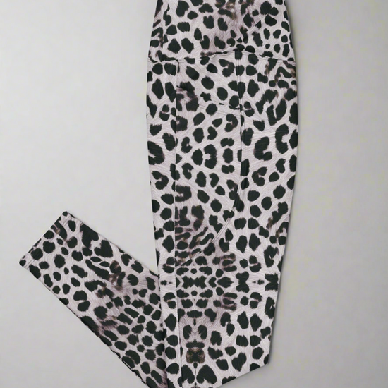 Right side flat lay view of Savannah Charge Crossover Leggings with pockets and leopard print, on a white background