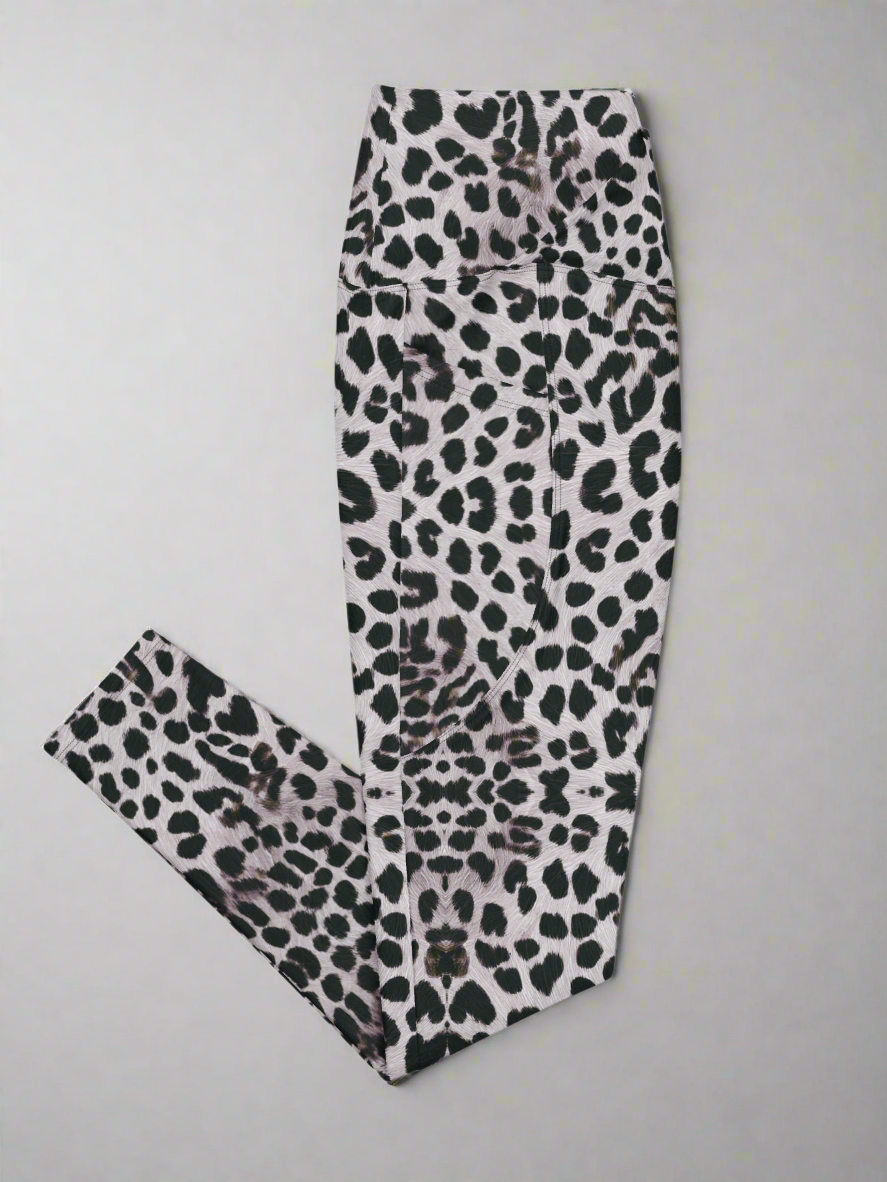 Right side flat lay view of Savannah Charge Crossover Leggings with pockets and leopard print, on a white background