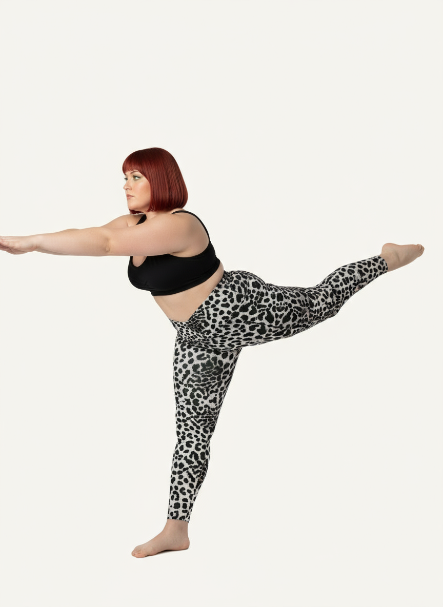 Person wearing black tank top and leopard print leggings on a white background