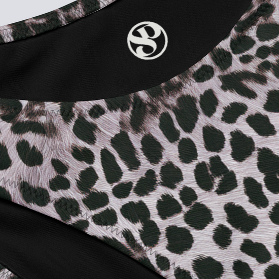 Close-up of Savannah Charge Cheeky Bikini Bottoms in monochrome leopard print, featuring Pixie & Sherbet logo and detailed stitching – bold, sculpting swimwear.