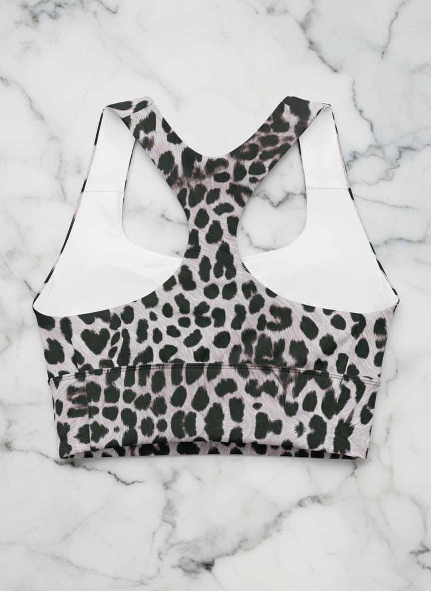Leopard print sports bra on a marble background
