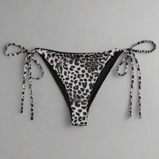 Leopard print bikini bottom with tie sides on a light gray background